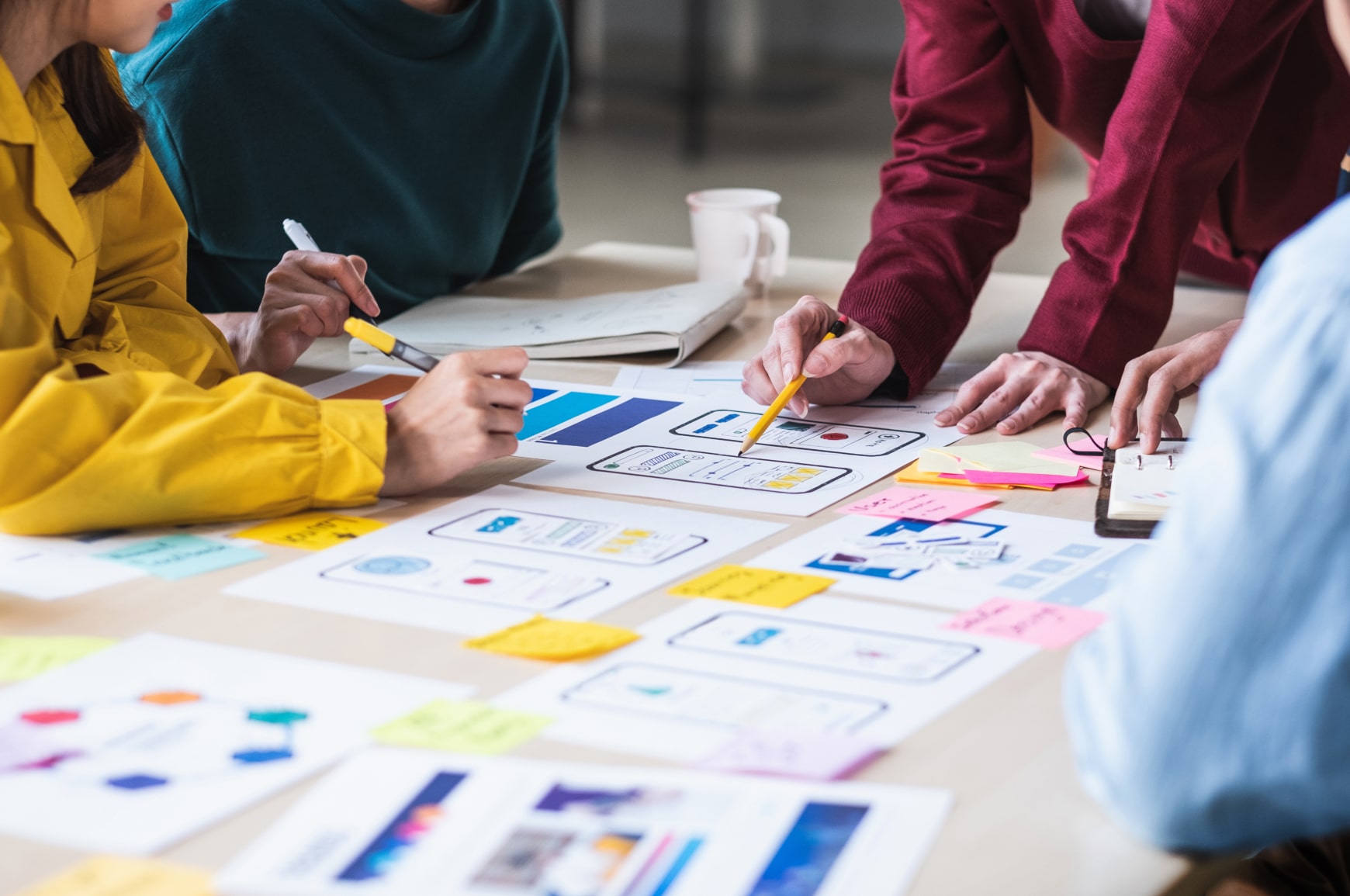 A team of 4 planning in-app information architectur