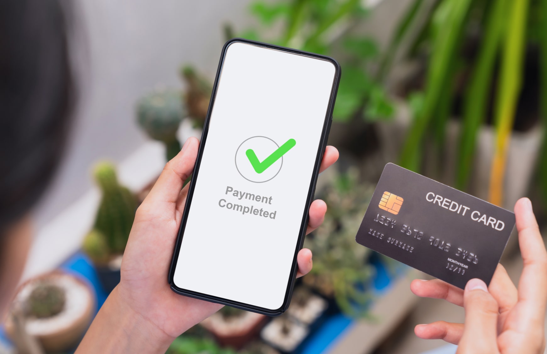 User making a successful ecommerce purchase on a smartphone